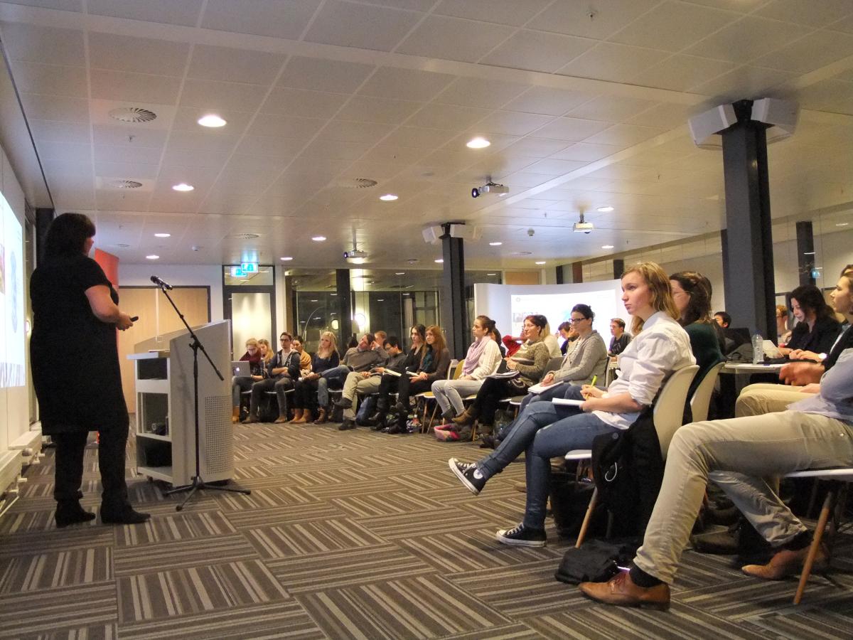 The audience listens attentively to Agnes Jongerius